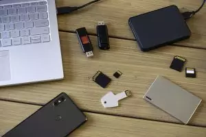 Various digital data storage devices. Usb sticks, external hard drive, SD cards, mini and micro SD cards, laptop and smartphone. Ready for destruction.