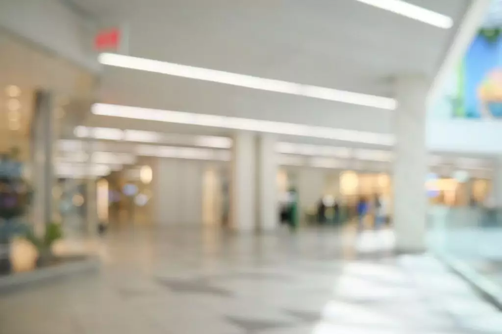 Blurred beautiful interior in modern shopping mall.